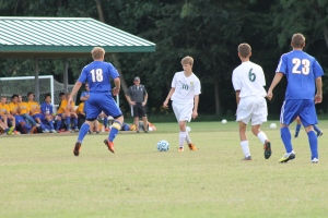 Sophomore Zach Yagle sets up a pass to freshman Ethan Worrall. Photo by Braden Schroeder. 